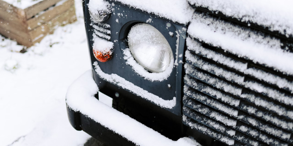 Close up of Jeep with snow on front of bumper