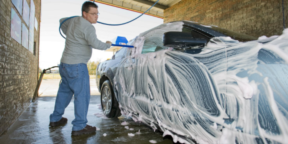 Man cleaning car